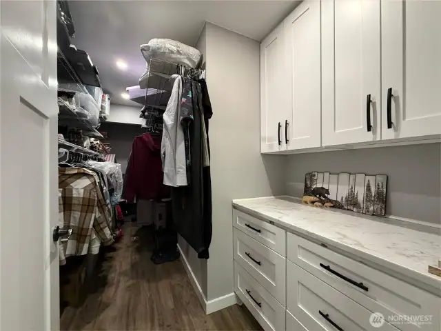 Extra large primary closet with custom build out.