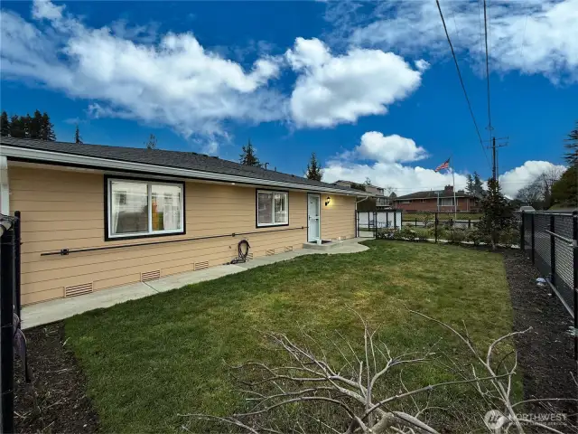 Side yard that is completely fenced in.