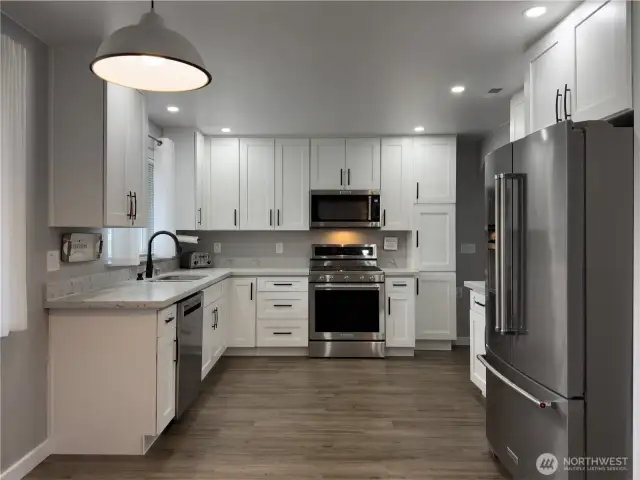 Bright open kitchen with quartz counters