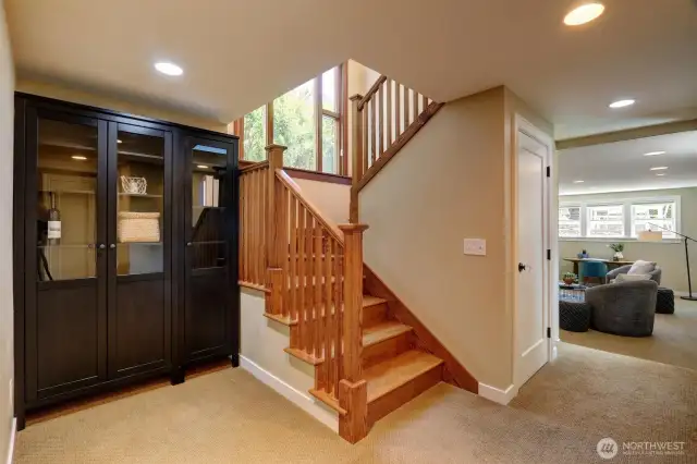 The lower level includes a spacious family room seen on the right.