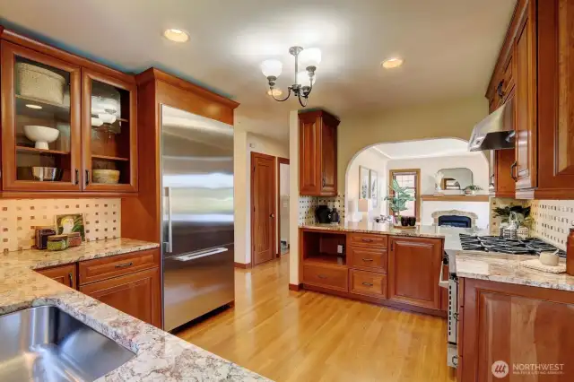 The kitchen boasts stone counters and a gorgeous stainless steel refrigerator/freezer from Miele. And the Miele dishwasher sits quietly adjacent to the fridge.