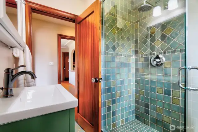 There's a beautiful ceramic tile shower in the main level bath.