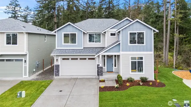 Picture of previously completed home in the same community. For illustrational purposes only. Actual plans and specs may vary. Some features shown are upgrades.