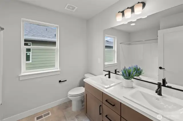 Picture of previously completed home in the same community. For illustrational purposes only. Actual plans and specs may vary. Some features shown are upgrades.
