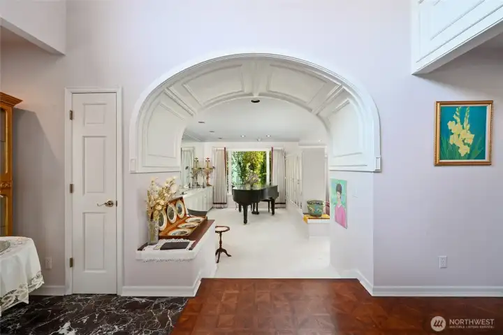 From the foyer, through the piano room, down into the living room, and back up through the dining room, this home sets the stage for truly gracious and formal entertaining.