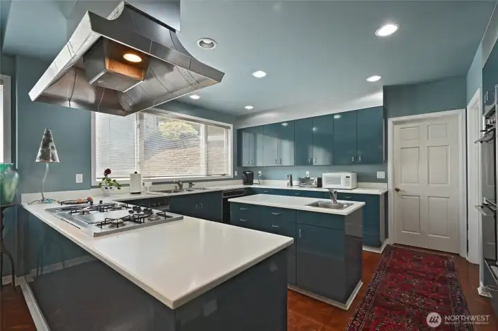 With miles of countertops and a spacious cooking island, preparing large meals here is a dream.