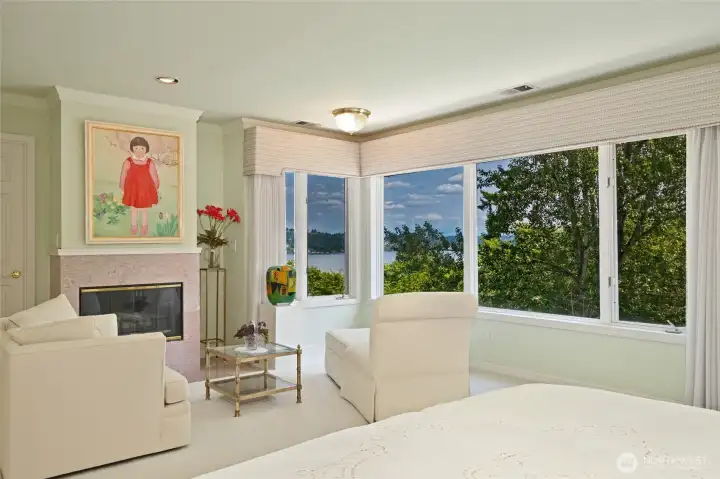 The primary is a genuine & gracious retreat with it's own fireplace and private deck.