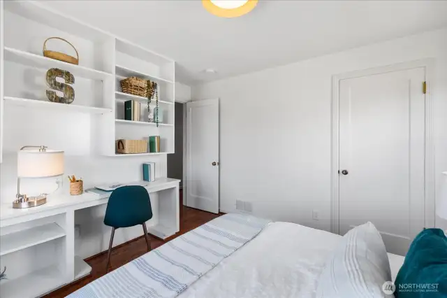 Main floor bedroom with closet and built in desk