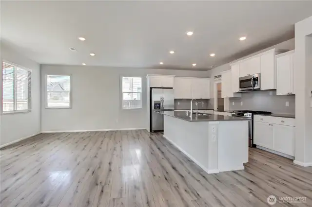 Beautiful kitchen and dining area. Slider off dining area leads to the covered patio.
