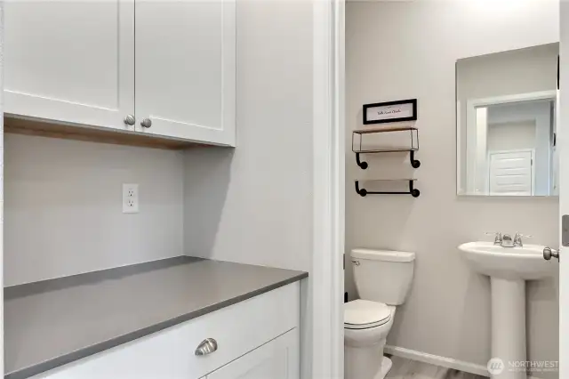 Butler pantry area next to a half bath.