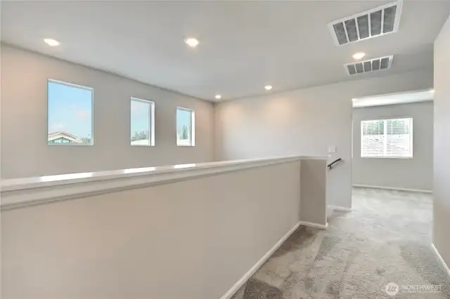 Upper hallway with lots of light.