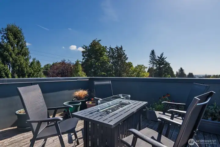 Rooptop deck with cozy firepit and territorial views.
