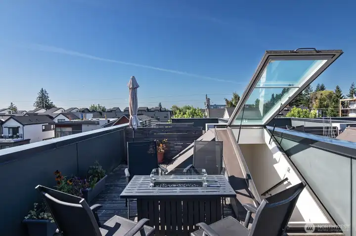Rooptop deck with cozy firepit and territorial views.