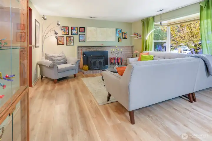The living room has luxury vinyl plank flooring which is both attractive and durable.