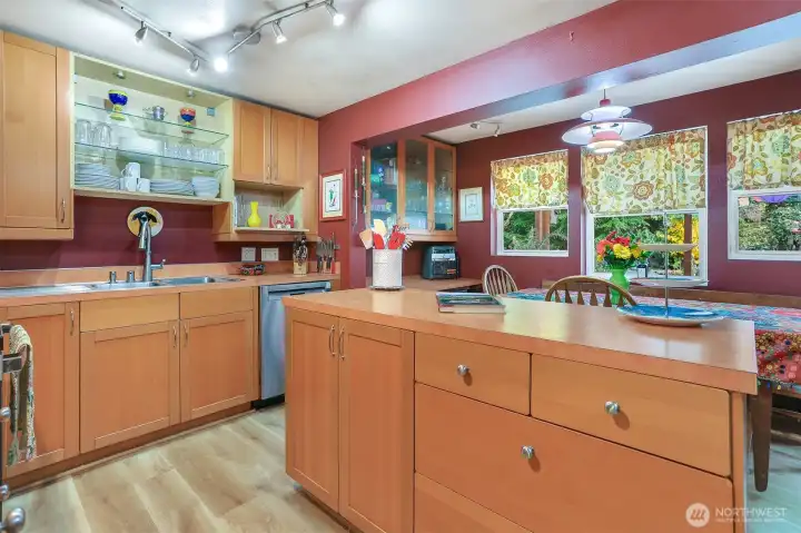 The remodeled kitchen has lots of great features! Bold artistic colors, modern fixtures and many custom built-ins.