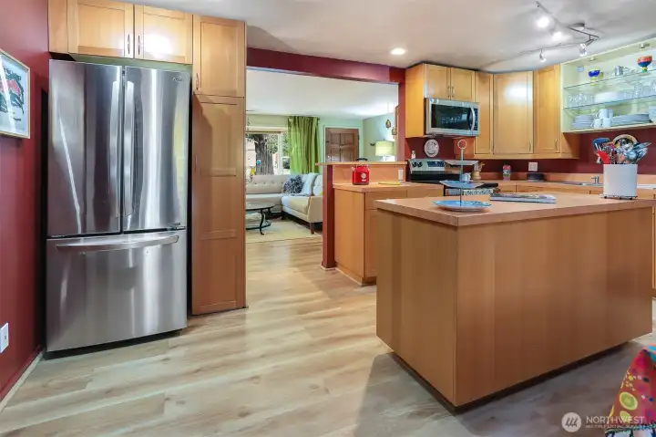 Kitchen has durable luxury vinyl plank flooring and Stainless appliances.