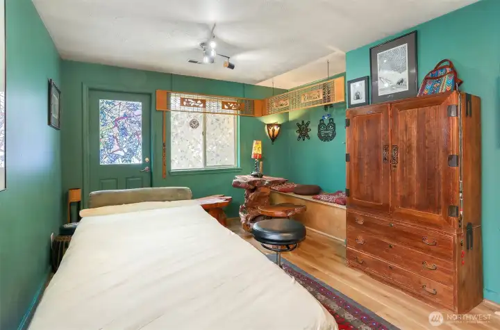 This is the fourth bedroom. It is currently being used as an Acupuncture Clinic. This has a separate entrance which is located directly in front of the parking area.