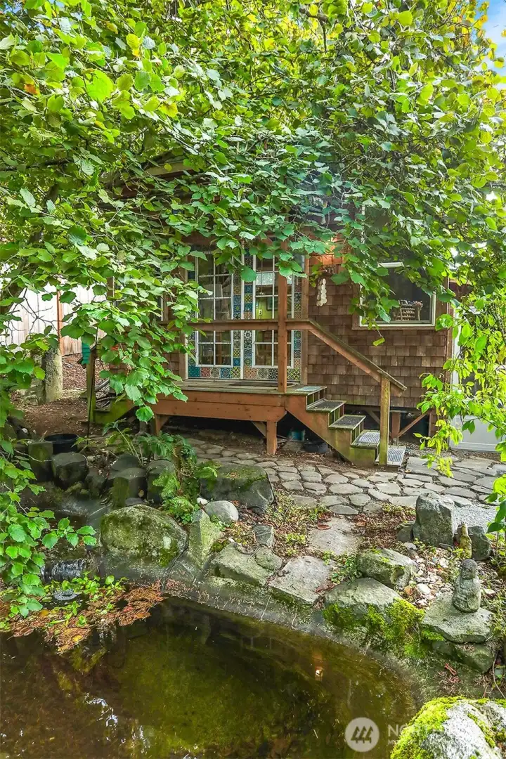The detached studio overlooks the peaceful Koi pond and waterfall.
