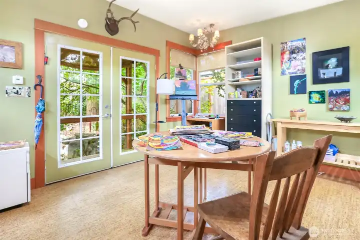 Handsome French doors lead out to the garden and overlook the Koi Pond.