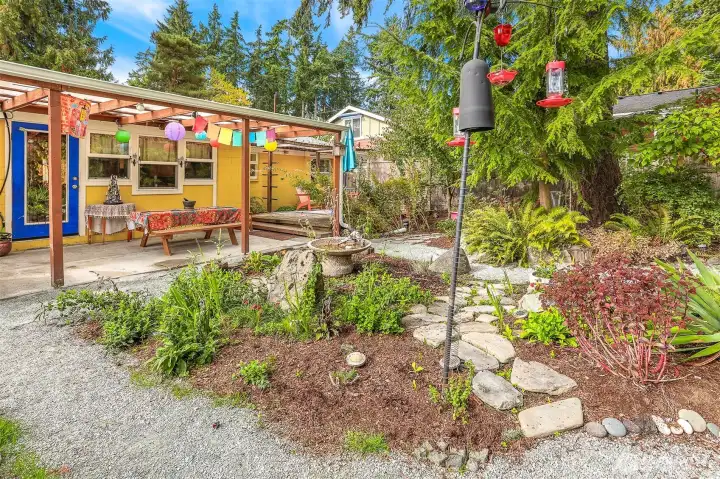 This area has lots of color in the Summer and the yard attracts many different species of birds.