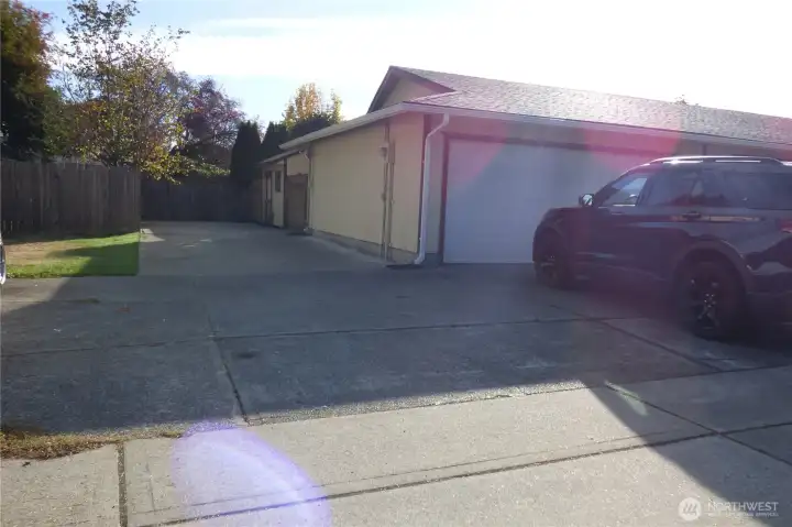 Long driveway along side of home.