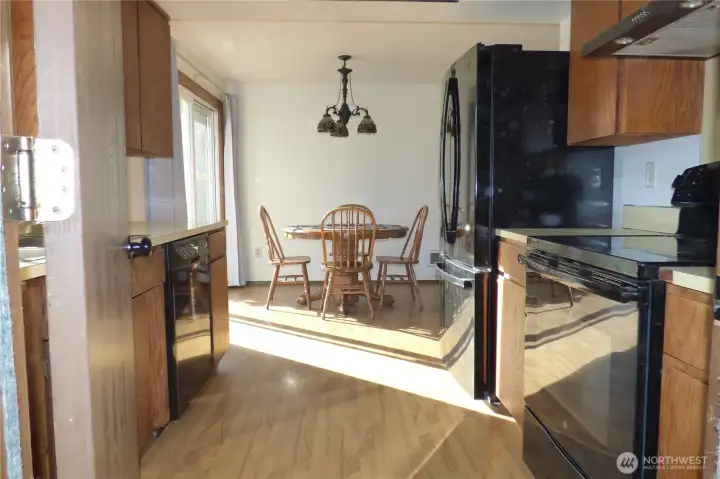 View from garage into kitchen and dining.