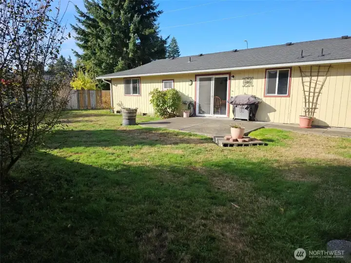 Large fenced backyard and patio.