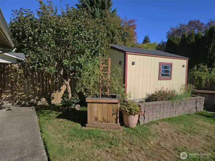 Shed that opens on the driveway side.