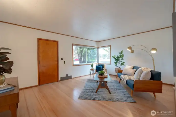 Large living room full of light and privacy.