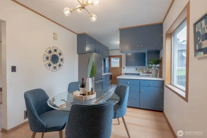 Dining area has original fir floors that have been completely refinished, large window to backyard