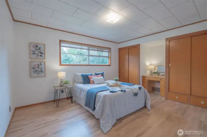 Light bathes this bedroom with custom built-in cabinets and vanity; original oak floors are totally refinished. Look at that gorgeous detail on ceiling!!