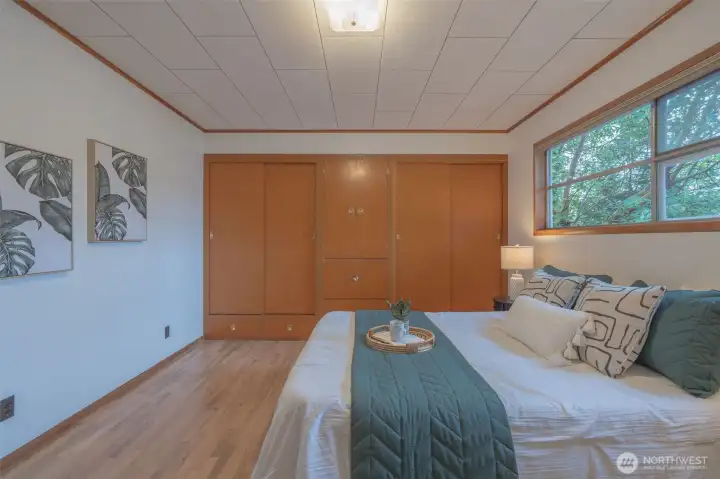 Second bedroom is also oversized and has built-in cabinets and large window to brighten even the gloomiest day!