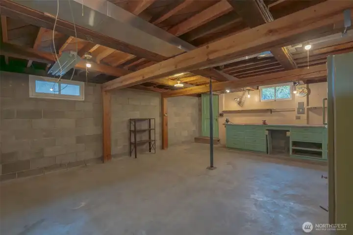 Separate back downstairs entrance...Rental opportunity? Multi-generational living? Home studio? Options are endless!