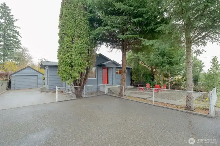 Large, deep driveway with one car garage that has more storage in open attic. There is parking for everyone here!