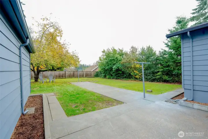 Massive backyard with so much privacy! Fruit trees, adorable clothesline! Plenty of space for outdoor activities, gardening and for the fur babies to run! Partially fenced--easy to close it in for a fully fenced backyard.