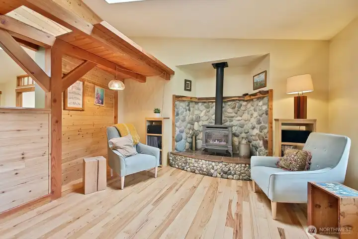 This is a great spot to have a conversation, read or relax.  Sellers updated the bulk of main living areas to Hickory flooring!