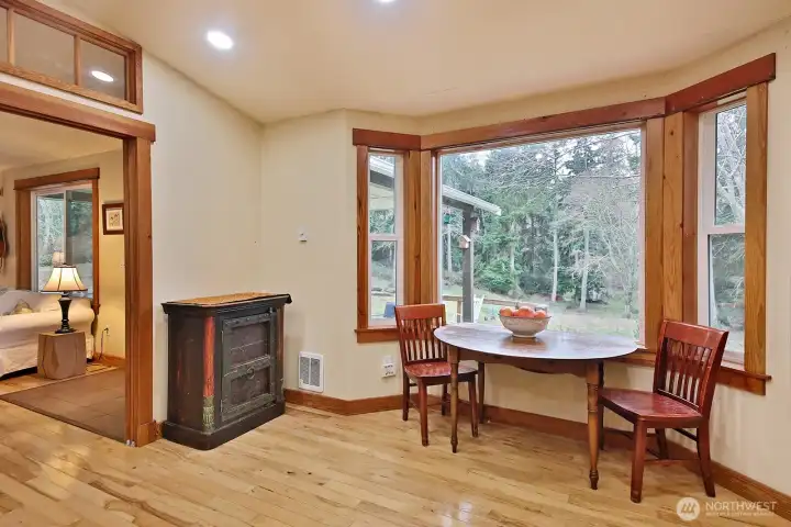 Living room flows into the kitchen with bay window eating space.