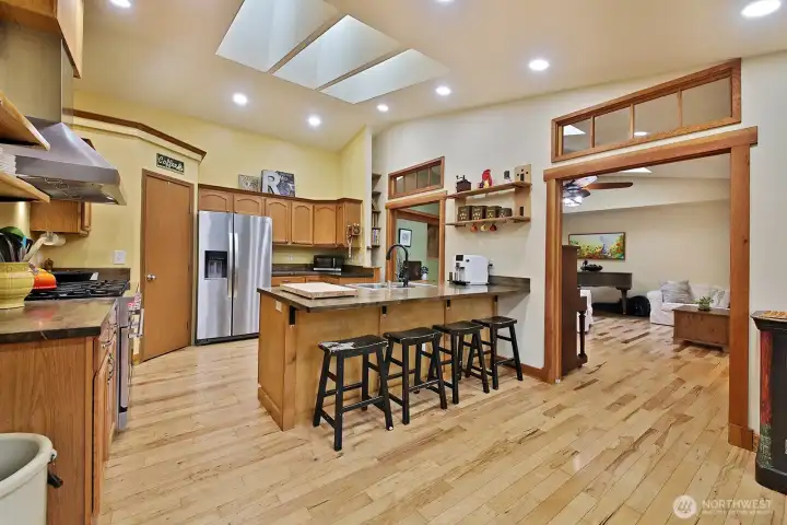Here is a cook's kitchen with pantry and room at the island for eating or conversation!