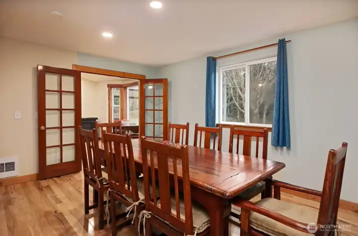 Formal dining with French doors just off the kitchen.