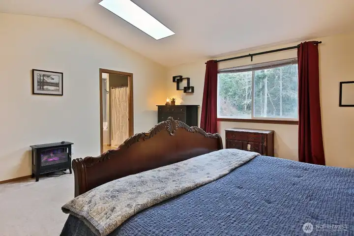 Primary ensuite with full bath and walk in closet.