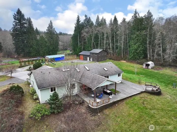 Mostly level yard  with an outbuilding and trees bordering for privacy...this is the end of the road and sellers have enjoyed the peace and quiet along with their ability to entertain guests!