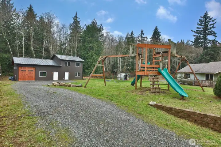 Almost new Spane built metal building!  This structure offers a garage/shop space, separate office, plus an almost finished Detached Auxillary Dwelling Unit!
