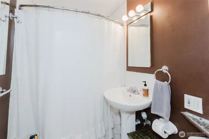 Bath/shower in the bathroom.