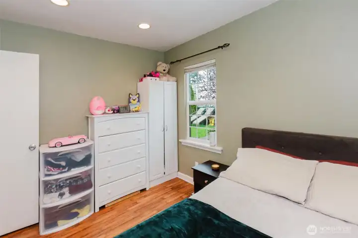 The window looks out to the backyard.