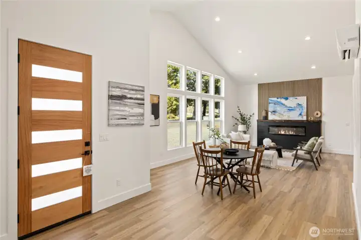 Upon entry walk into the open concept with Soaring vaulted ceilings reaching approximately 14 feet at the peak create an open, airy atmosphere throughout the main living space