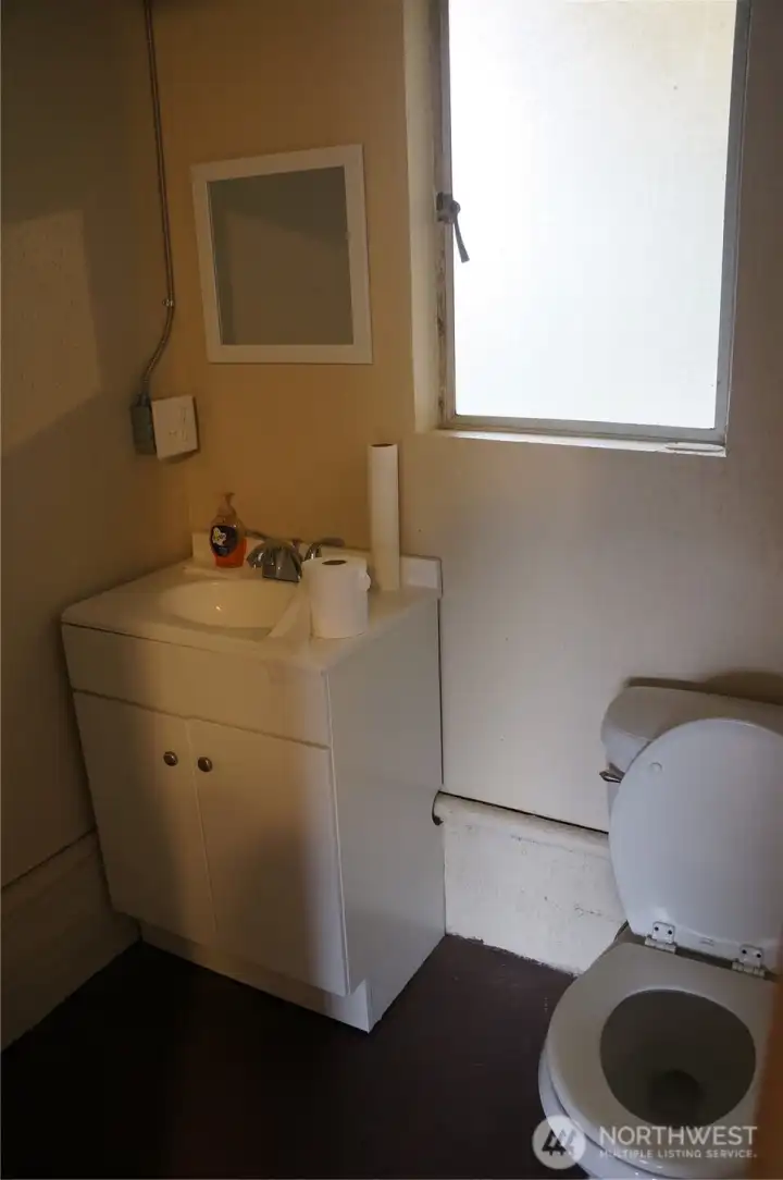 Bath adjacent to Washer & Dryer