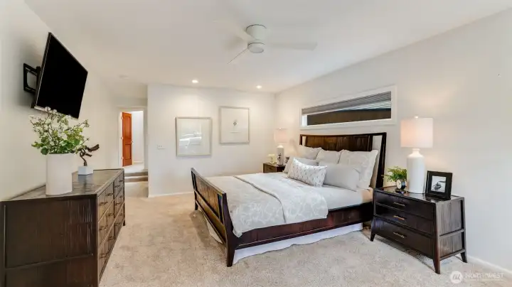 A different view of the primary suite. This room has a private door leading directly to the family room.