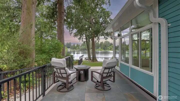 Private patio off of the primary suite with serene views of the lake.
