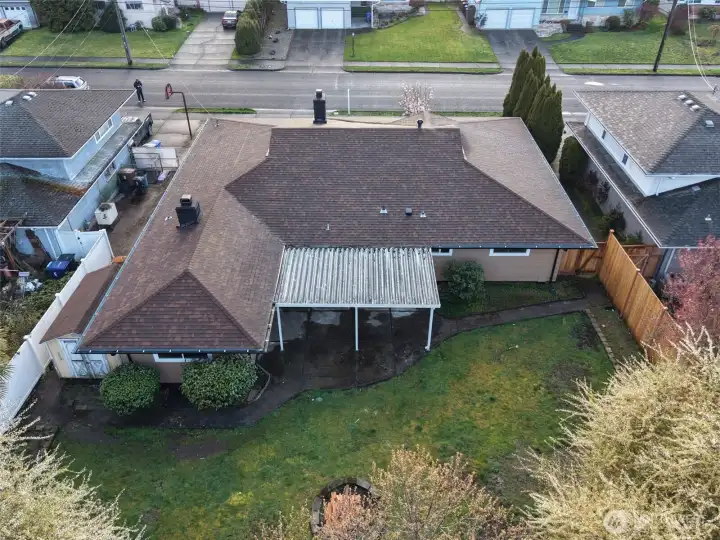 Large backyard with a covered patio