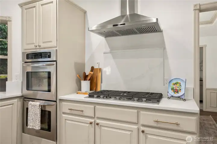 New gas cooktop, hood and countertops